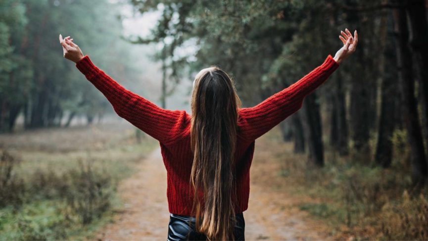 Woman with arms outstretched in a forest path. Coping with anxiety in Oregon can be difficult. Get help from a Christian therapist for anxiety treatment in Clackamas or Beaverton here.